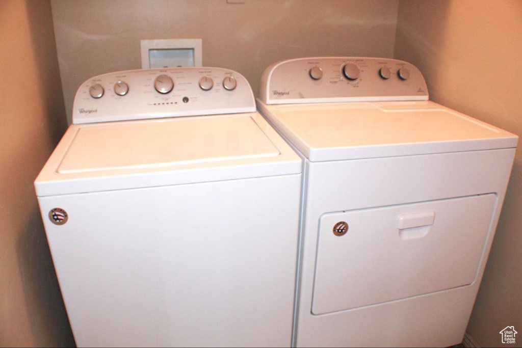 Laundry room featuring washer hookup and washing machine and clothes dryer