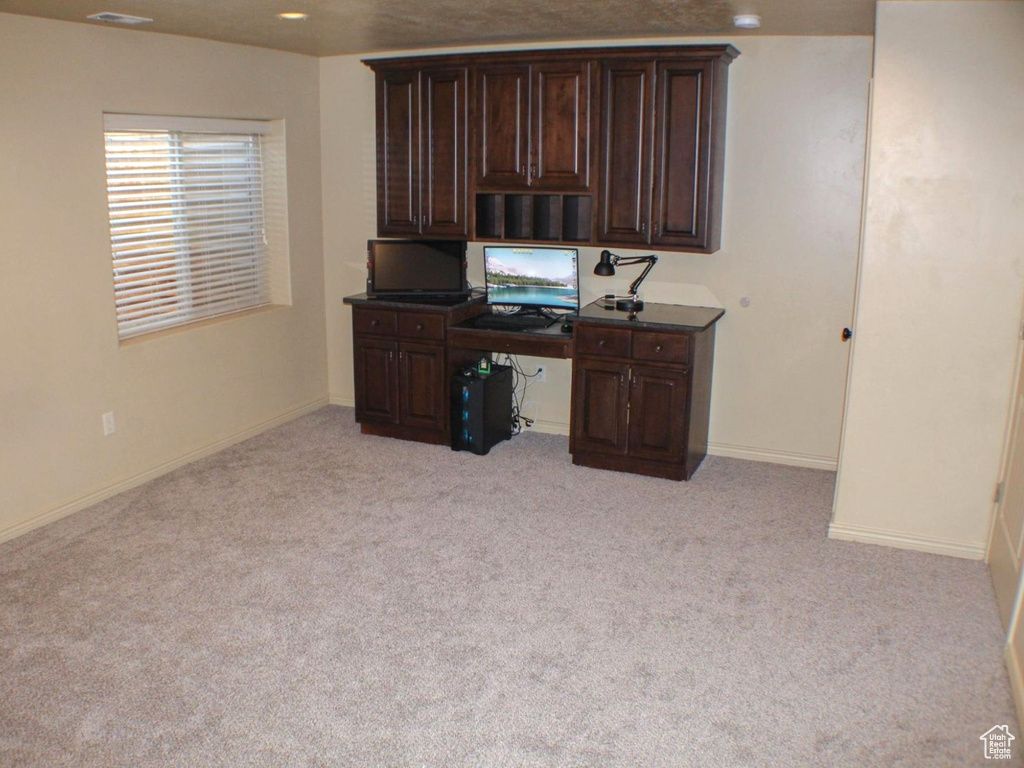 Office area featuring light colored carpet