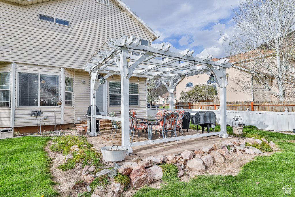 View of yard with a patio and a pergola