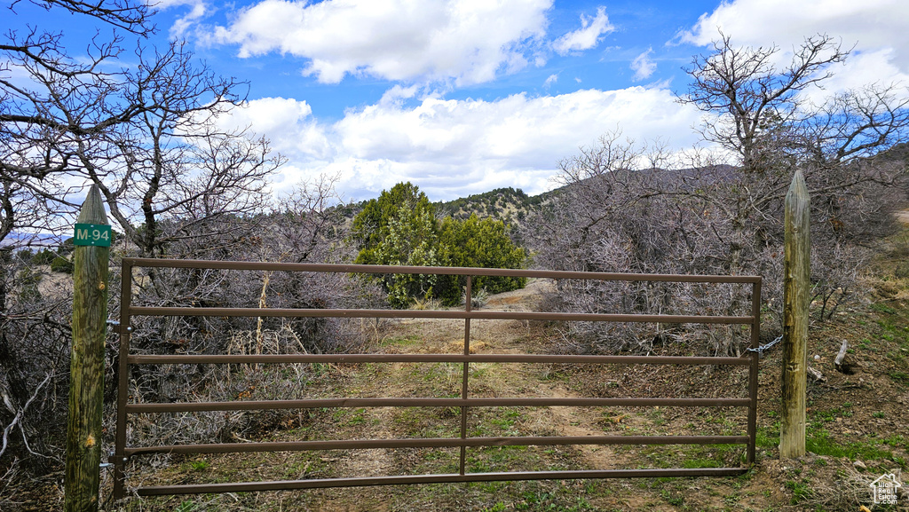 View of gate with a mountain view