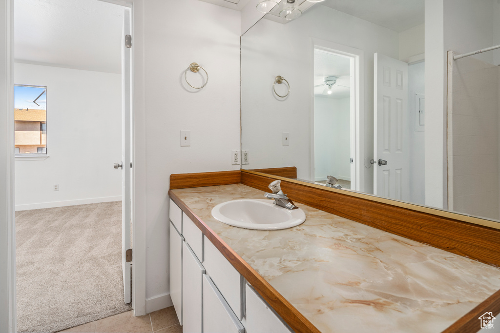 Bathroom featuring tile flooring and oversized vanity