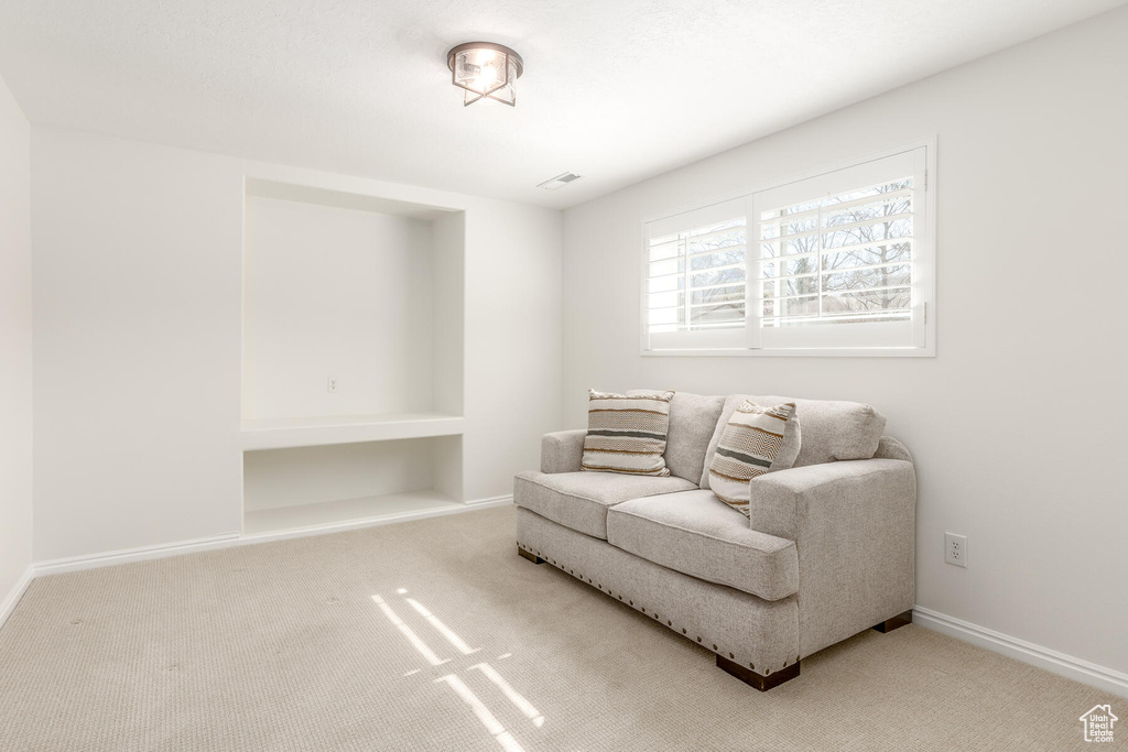 Living area featuring carpet