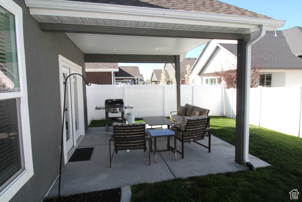 View of patio featuring grilling area and an outdoor hangout area