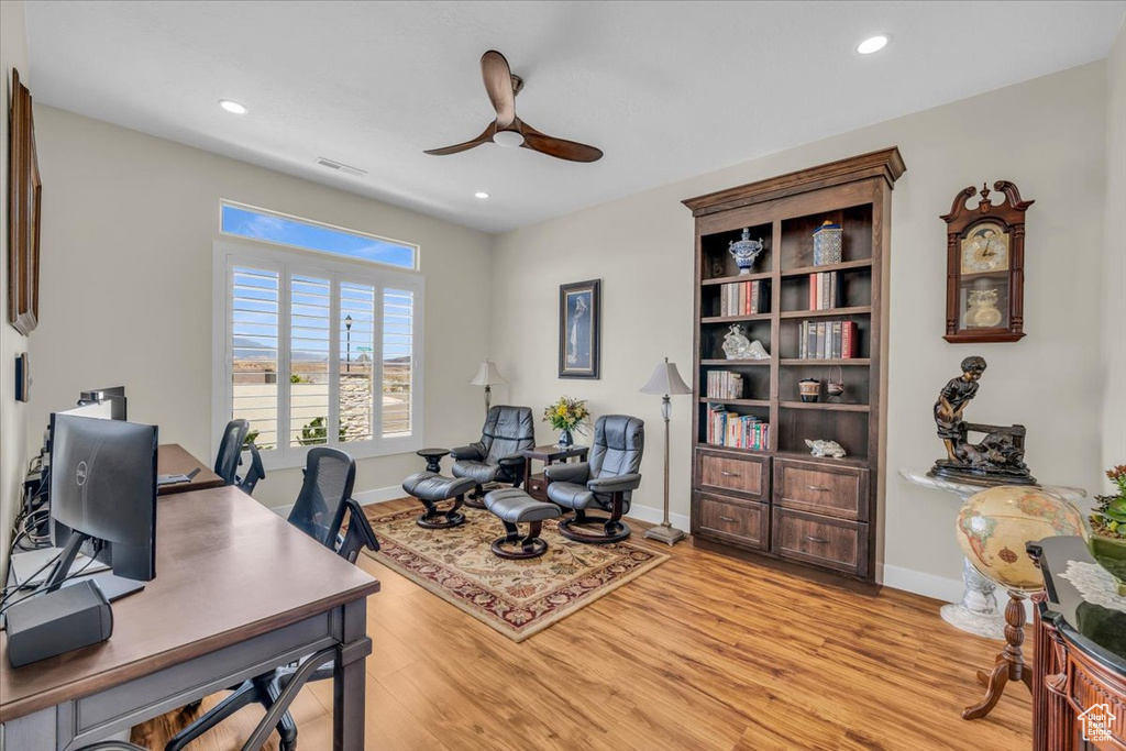 Office space featuring light hardwood / wood-style flooring and ceiling fan