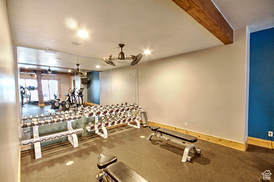 Workout area featuring carpet flooring and a textured ceiling