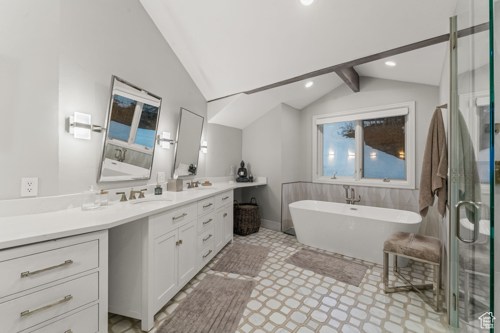 Bathroom featuring lofted ceiling with beams, independent shower and bath, vanity, and tile floors