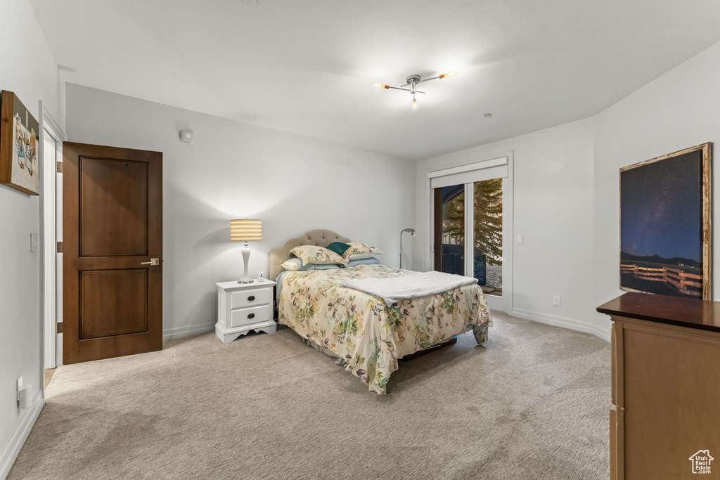 Carpeted bedroom featuring access to exterior