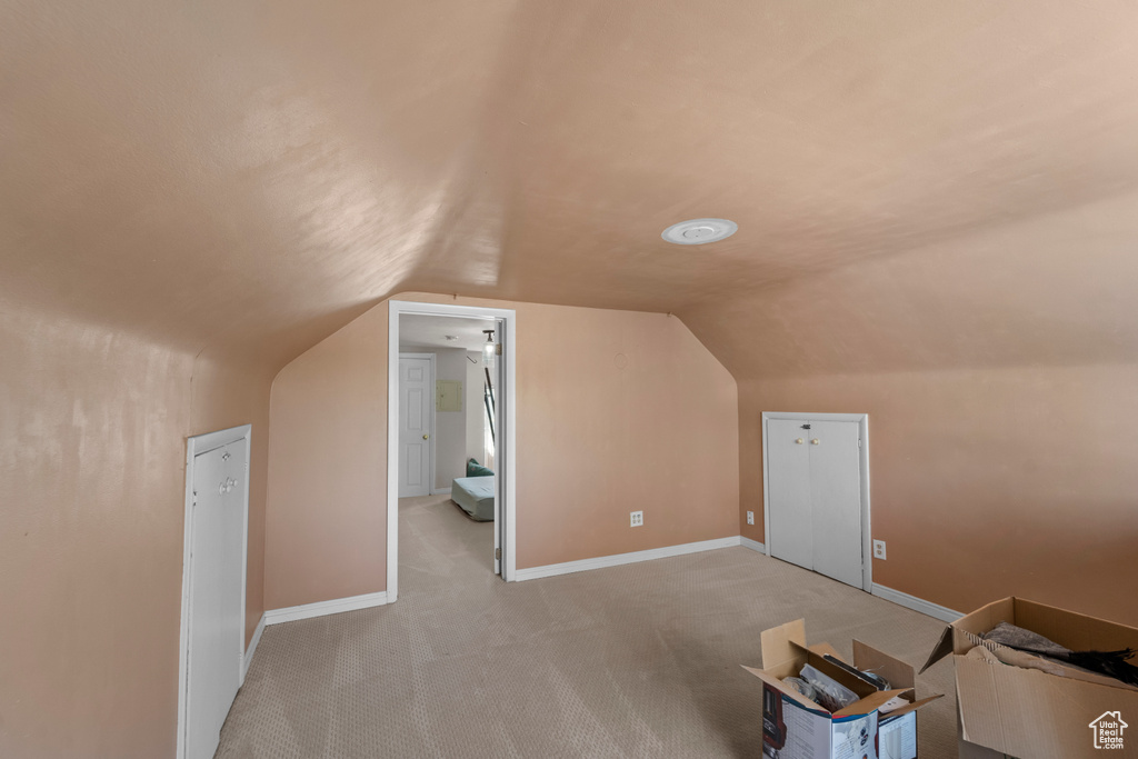 Bonus room with lofted ceiling and carpet floors