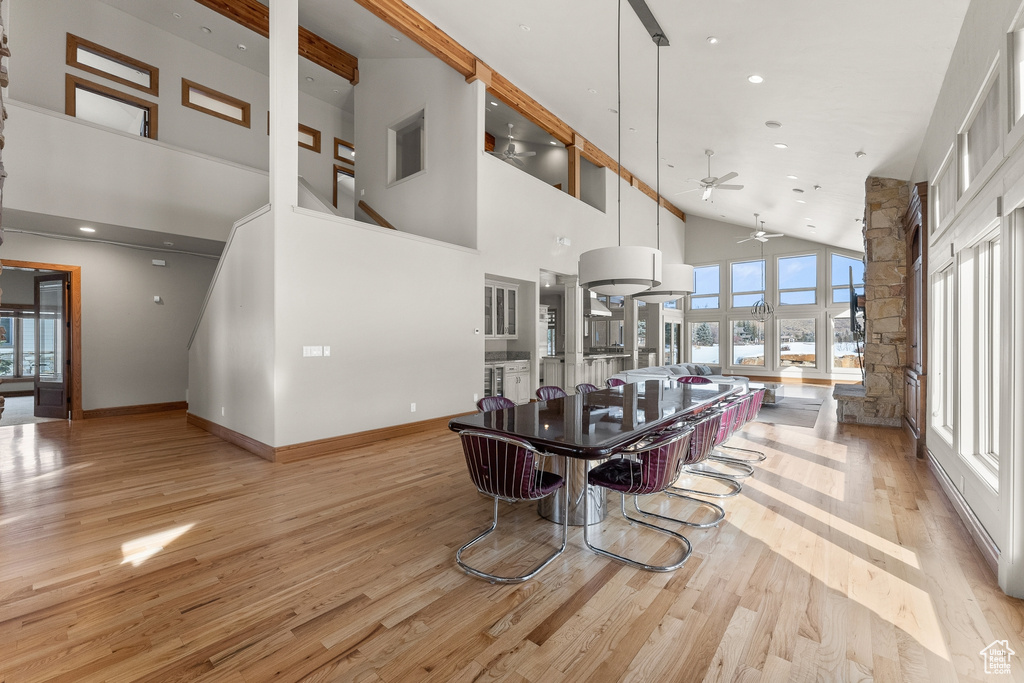Interior space featuring light hardwood / wood-style flooring, high vaulted ceiling, and ceiling fan
