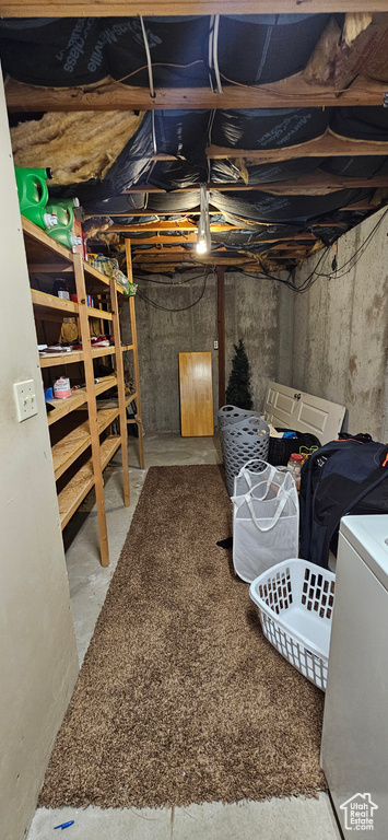 Basement with washing machine and clothes dryer