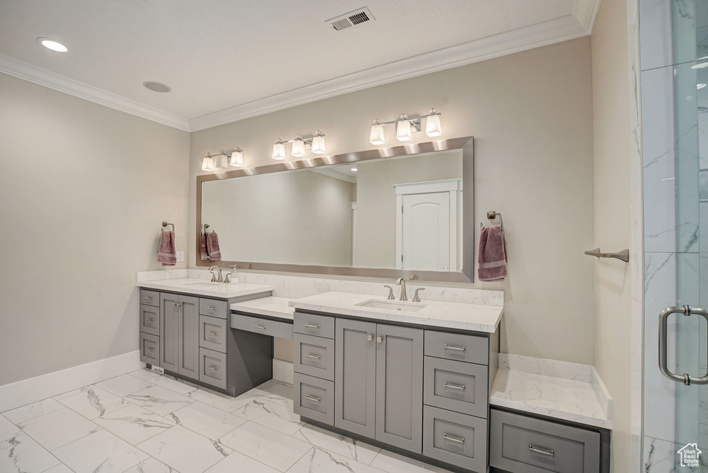 Bathroom with tile flooring, vanity, and crown molding