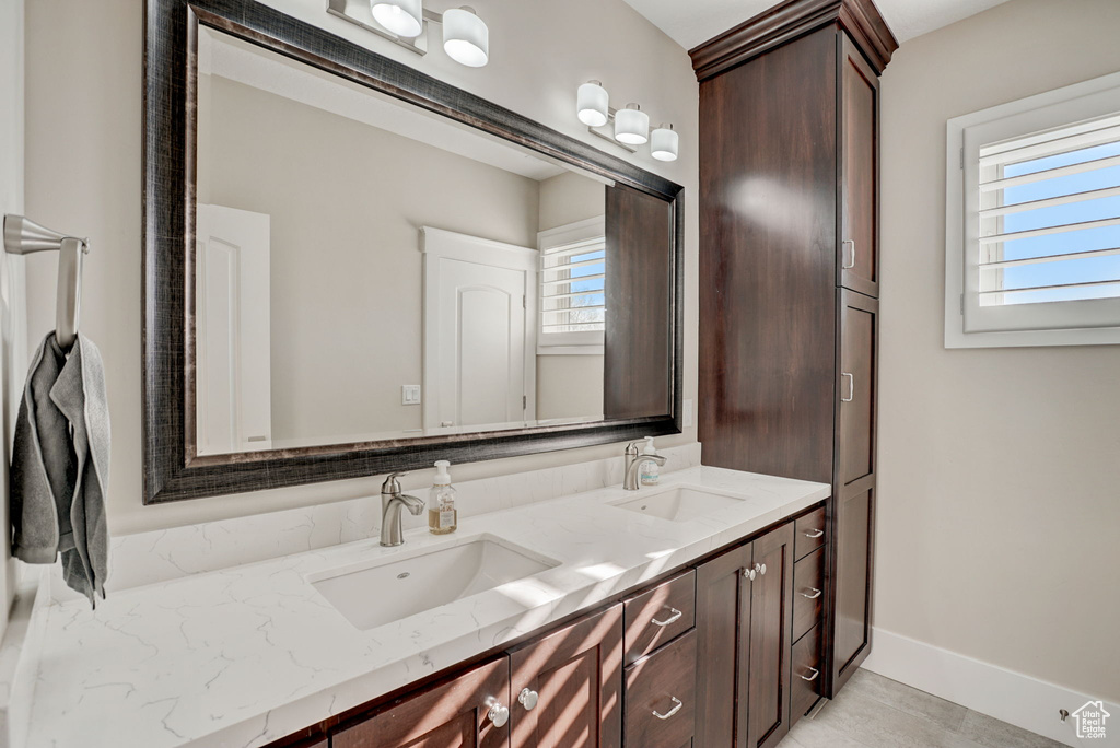 Bathroom with dual sinks and oversized vanity