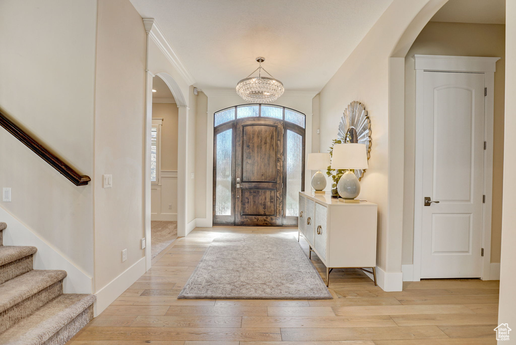 Entrance foyer featuring light wood-type flooring