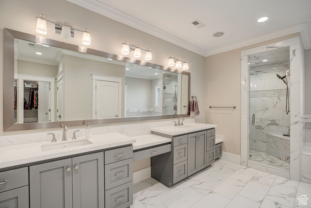 Bathroom with walk in shower, ornamental molding, tile flooring, and vanity