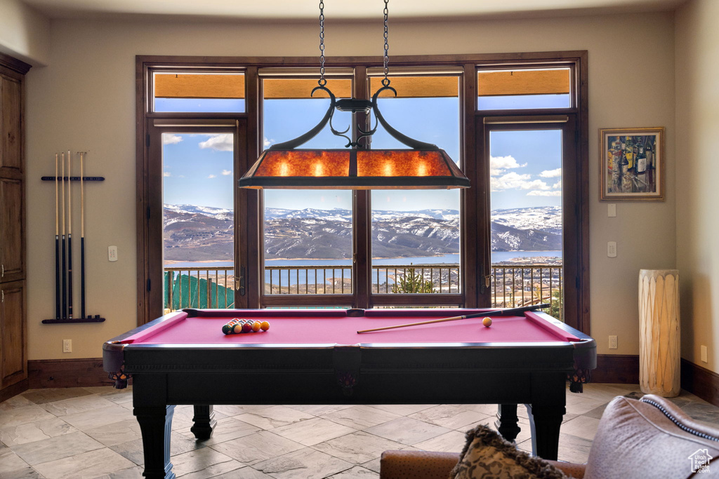 Game room featuring a wealth of natural light, pool table, and tile flooring