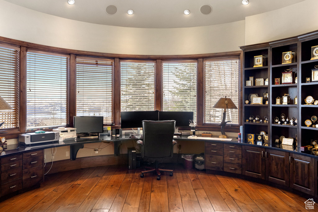 Office area with hardwood / wood-style flooring