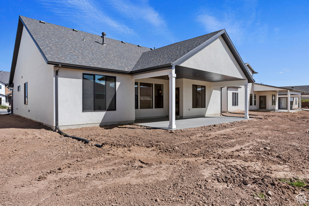 Rear view of house featuring a patio