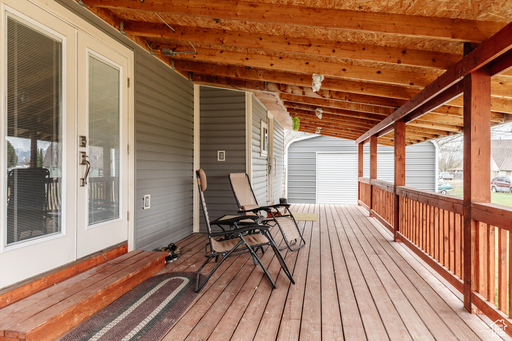 Deck featuring french doors and an outdoor structure