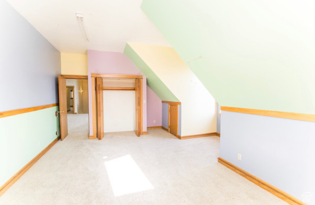 Bonus room with light colored carpet