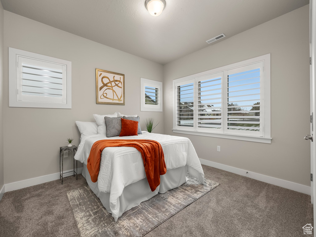 Bedroom featuring carpet flooring