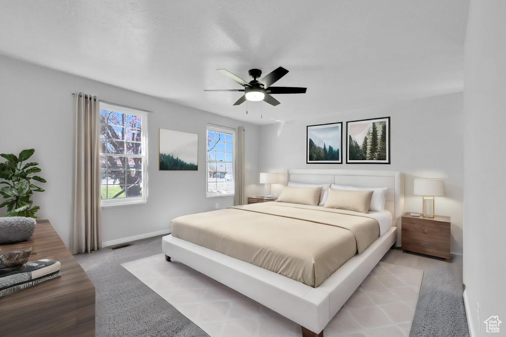 Bedroom with ceiling fan and light hardwood / wood-style floors