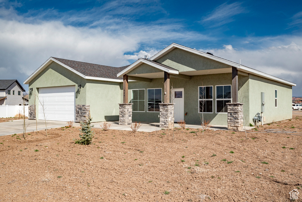 View of front of home featuring a garage