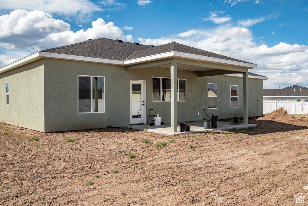 Rear view of property with a patio area