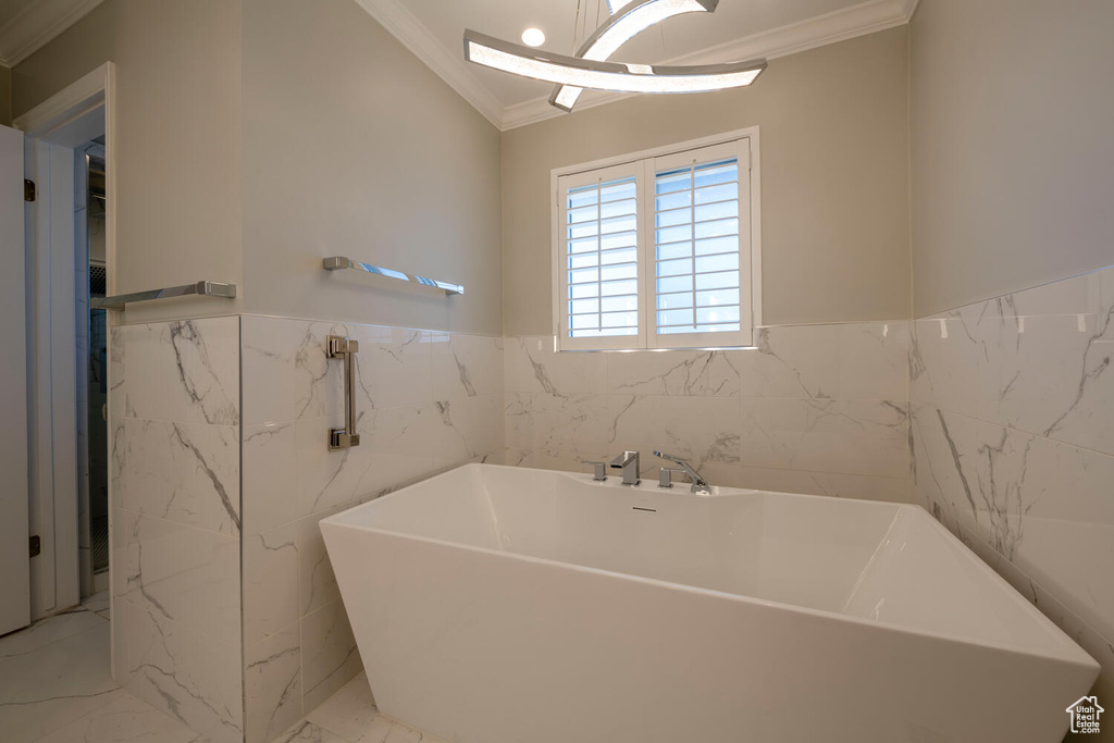 Bathroom featuring tile walls, tile floors, and crown molding
