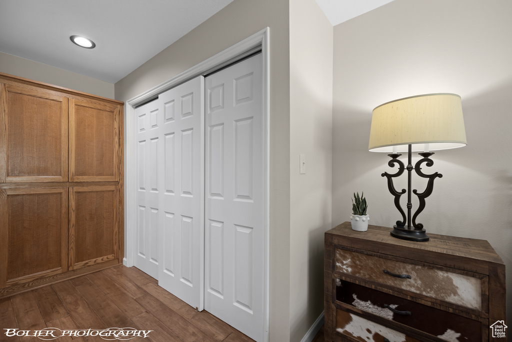 Corridor with dark hardwood / wood-style floors