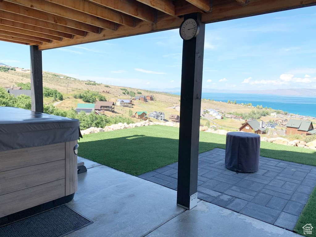 View of patio / terrace with a water view