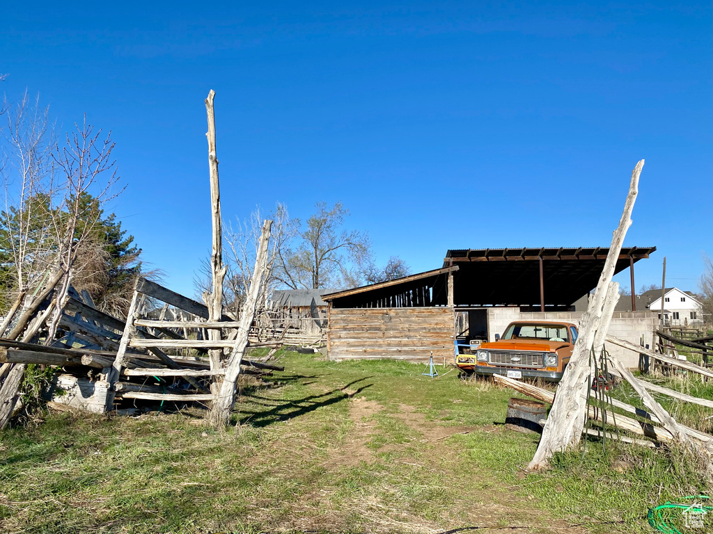 View of yard with a carport