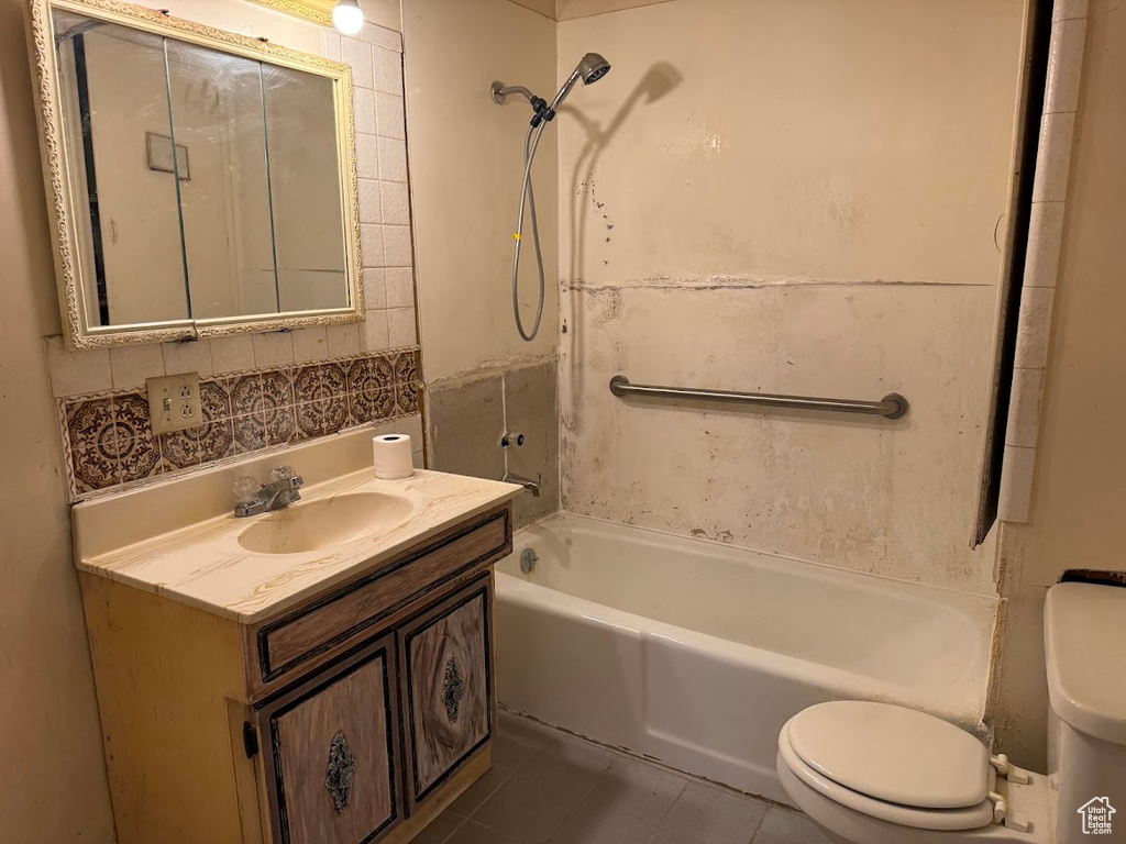 Full bathroom featuring tile patterned floors, shower / bathtub combination, vanity, and toilet