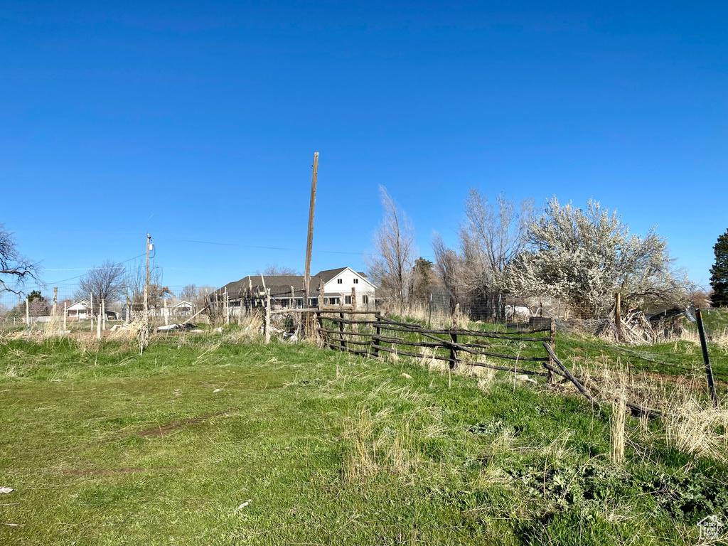 View of yard with a rural view