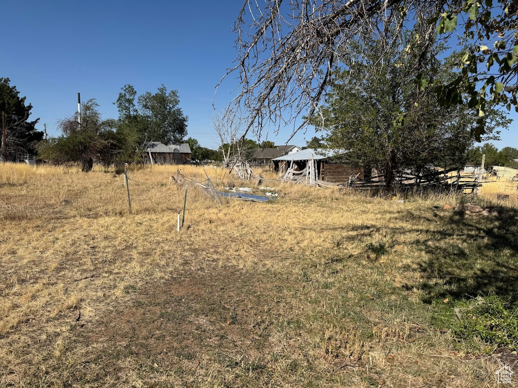 View of yard with a rural view