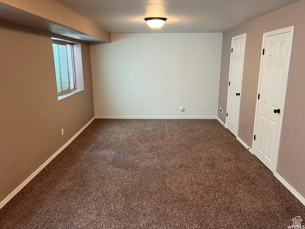 Empty room with carpet floors