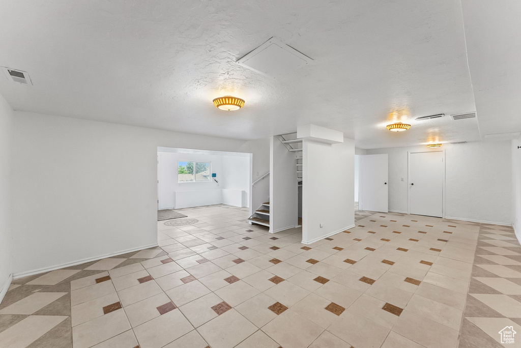 Basement with light tile floors