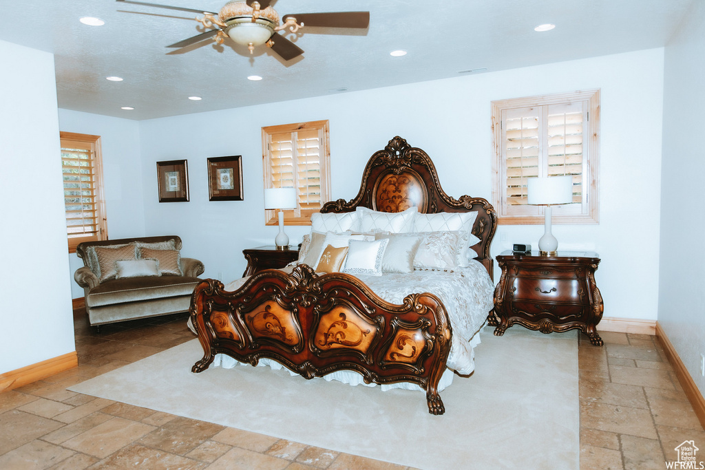 Tiled bedroom with ceiling fan