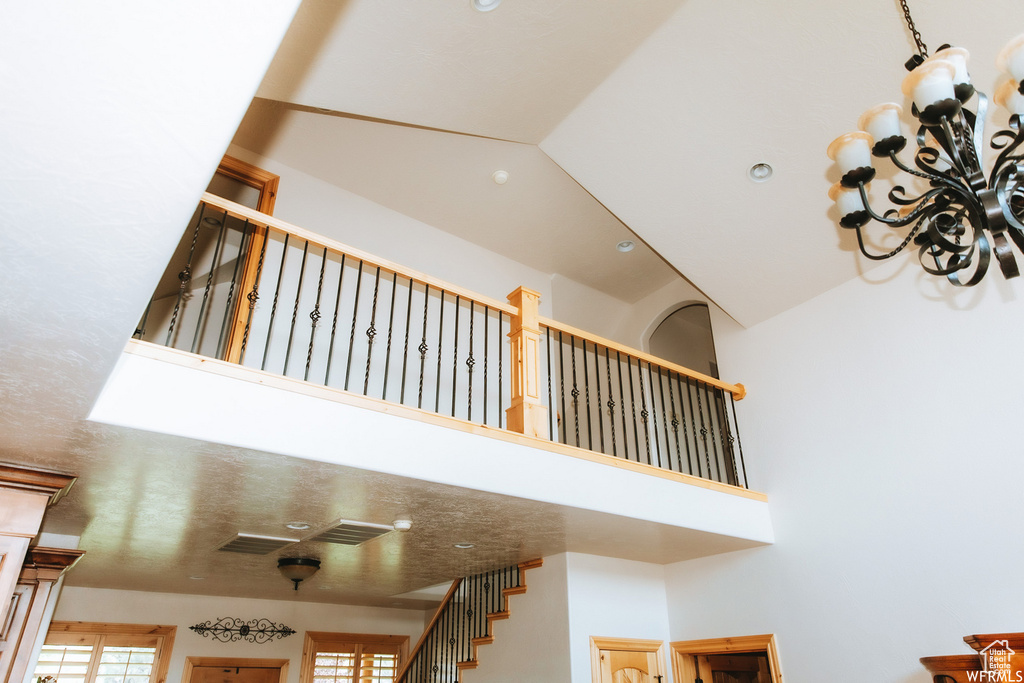 Stairs featuring a towering ceiling