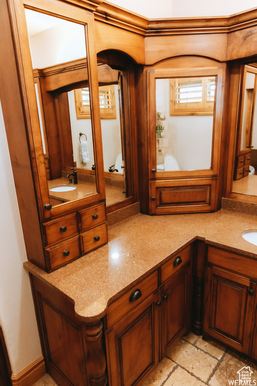 Bathroom with vanity and tile flooring