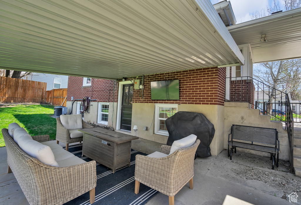 View of patio featuring central AC and an outdoor hangout area
