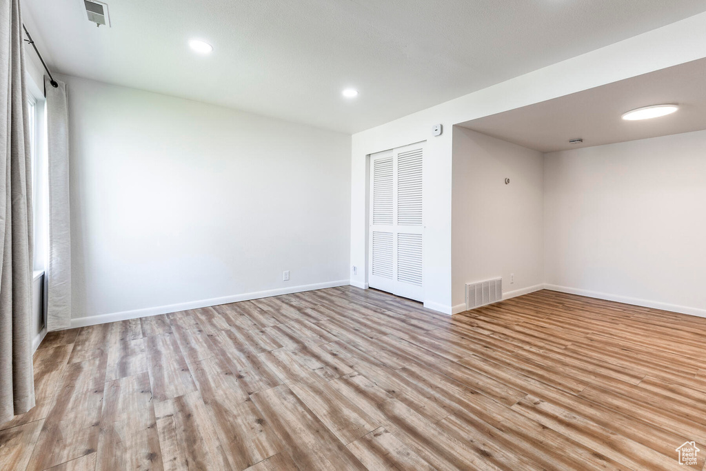 Spare room featuring light wood-type flooring