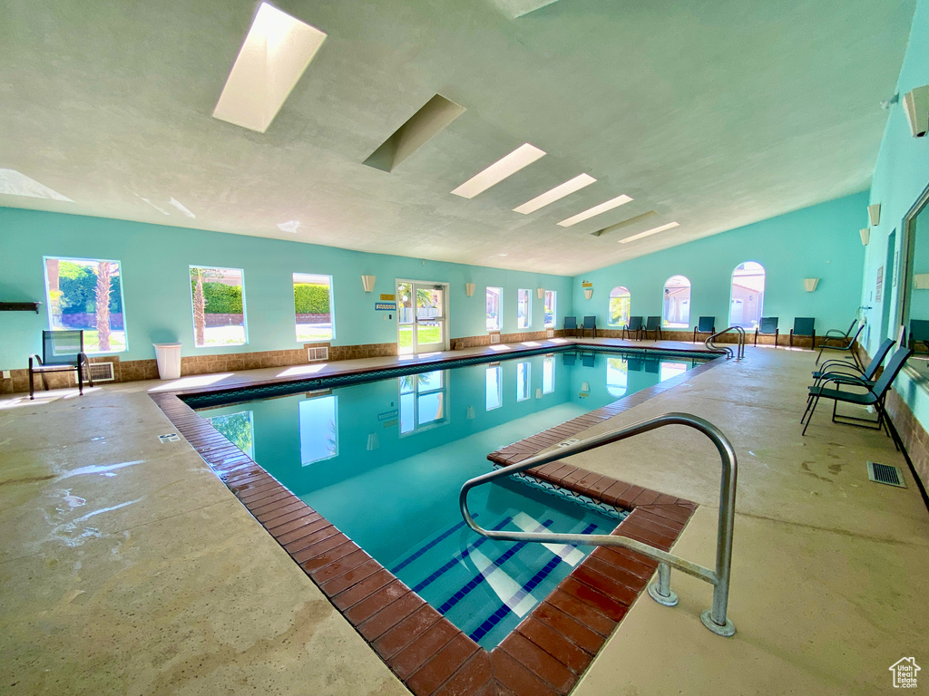 View of swimming pool with a skylight