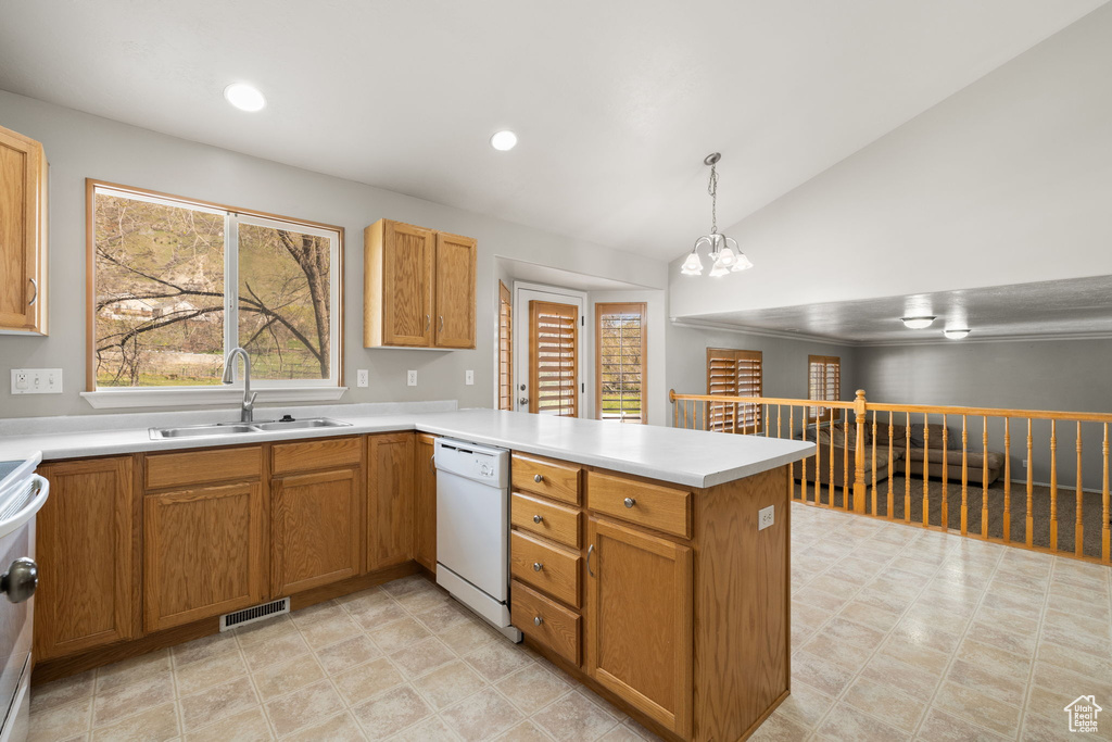 Kitchen featuring light tile floors, dishwasher, kitchen peninsula, sink, and decorative light fixtures