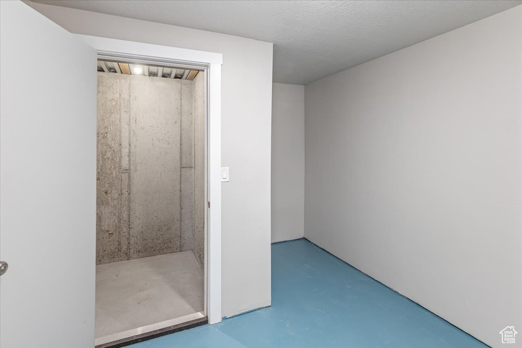 Bathroom featuring concrete flooring