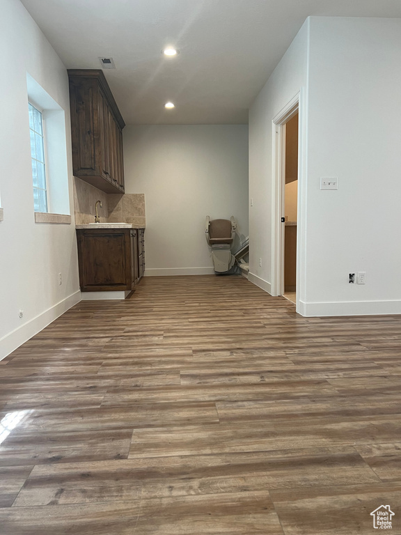 Interior space featuring wood-type flooring and dark brown cabinets