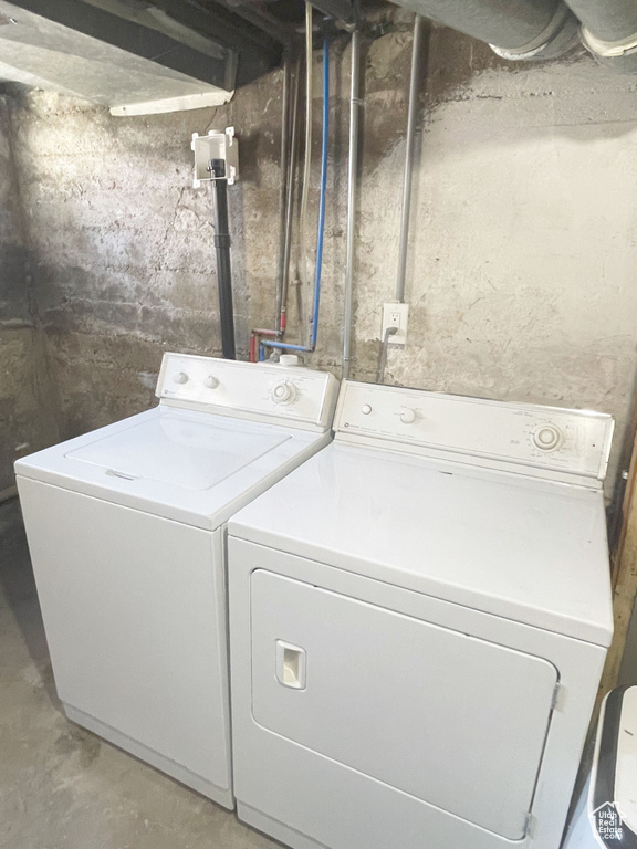 Clothes washing area with washer hookup and washing machine and dryer