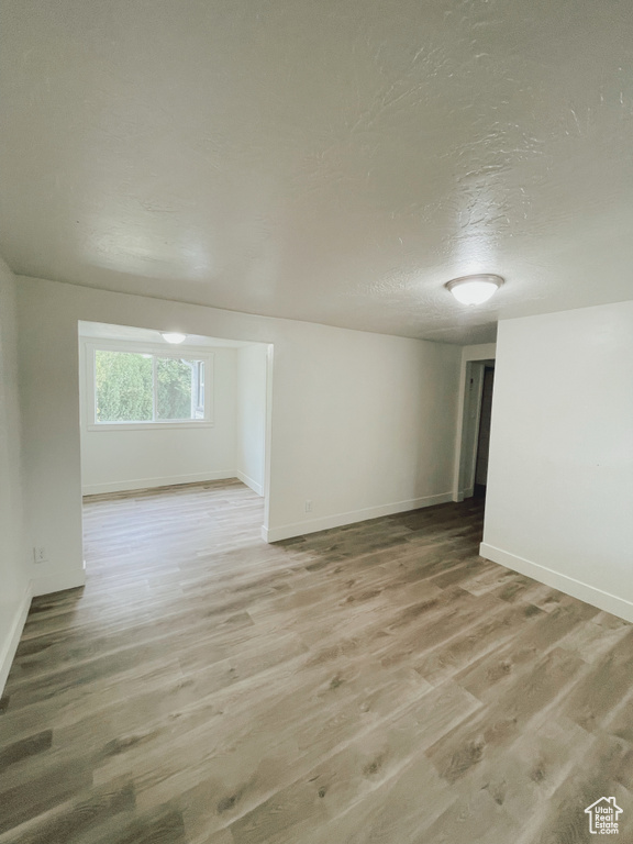 Unfurnished room featuring wood-type flooring
