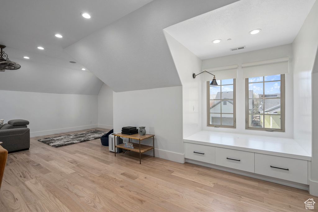 Bonus room featuring lofted ceiling and light hardwood / wood-style floors