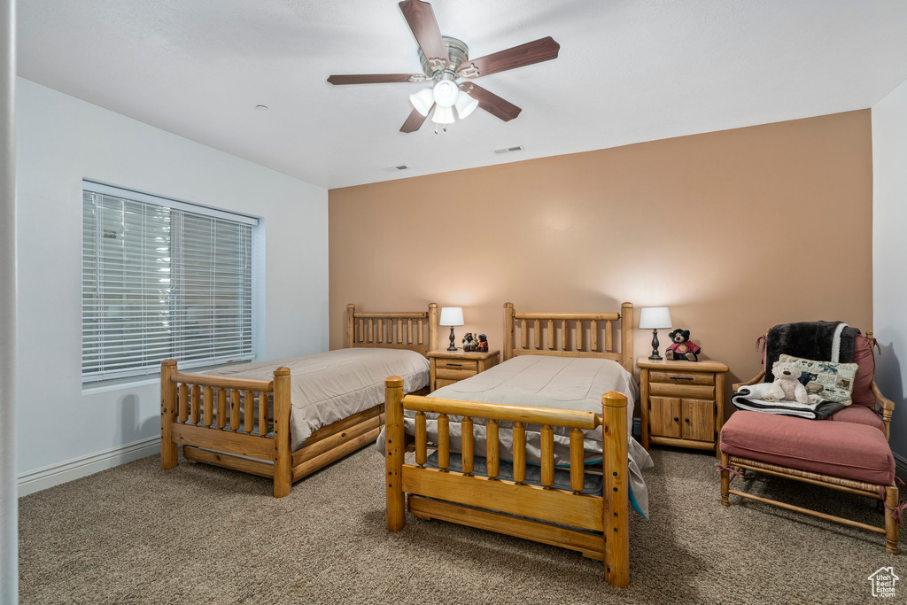 Bedroom with carpet flooring and ceiling fan