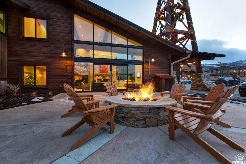 View of terrace with an outdoor fire pit